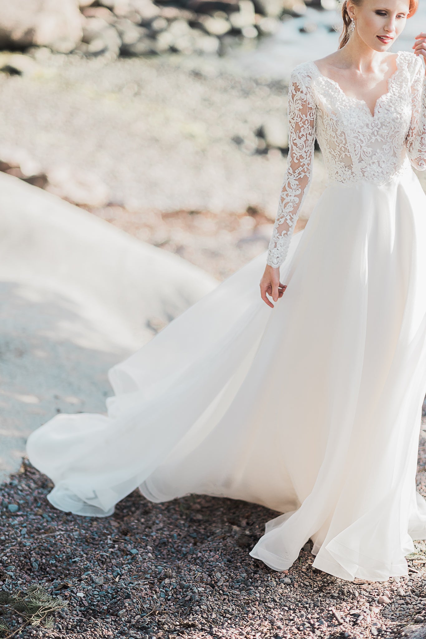 A beautiful A-line wedding dress made using beaded ivory lace Ava