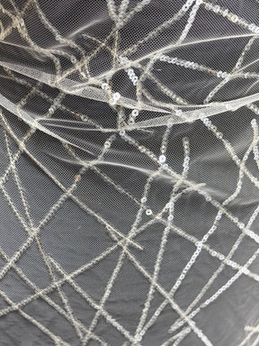 Tulle brodé de sequins ivoire - EB3022