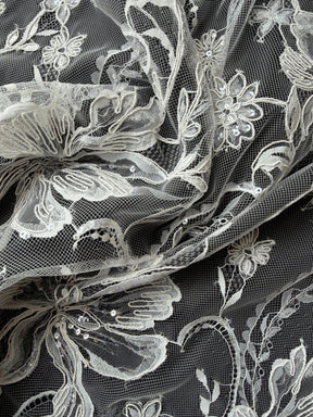 Dentelle en ivoire brodée de cordelettes et de sequins - Ladina