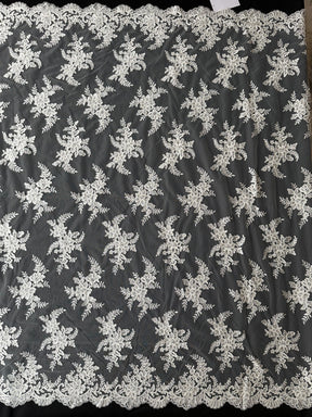 Dentelle brodée ivoire à cordon - P233
