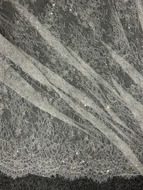 Dentelle ivoire à cordons et paillettes - Fronnie 