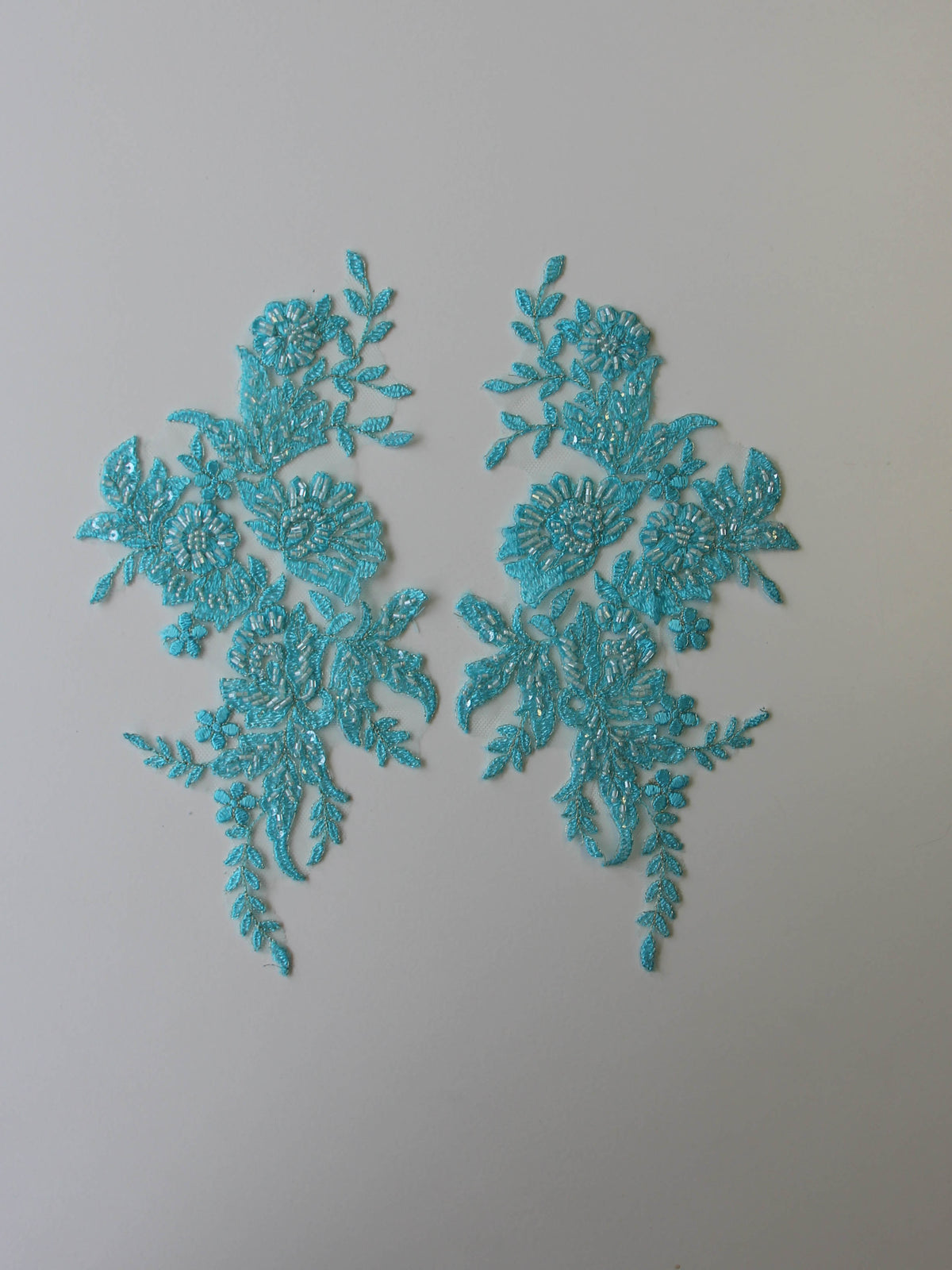 Appliques en dentelle turquoise – Nicole.